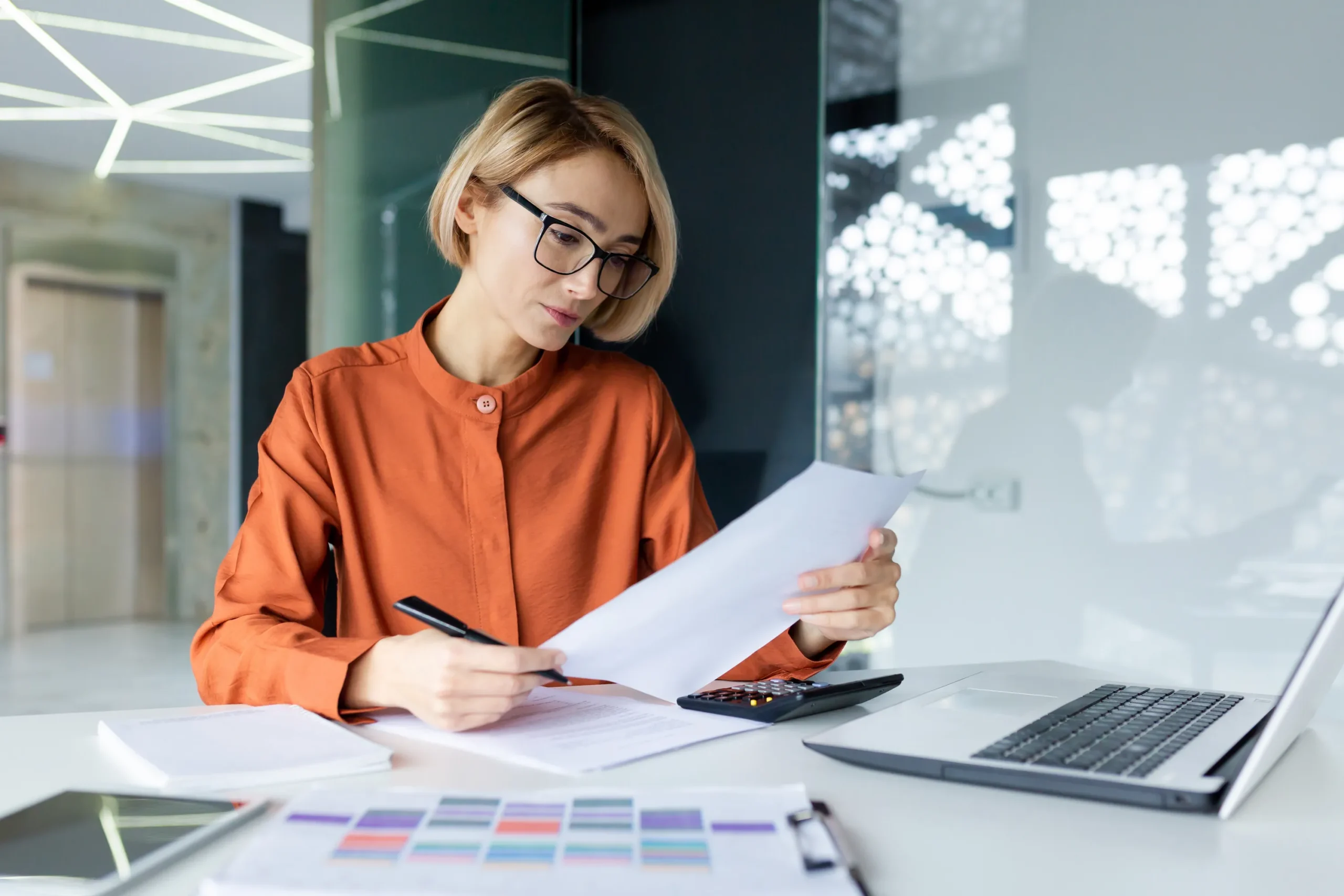 business owner reviewing tax documents scaled